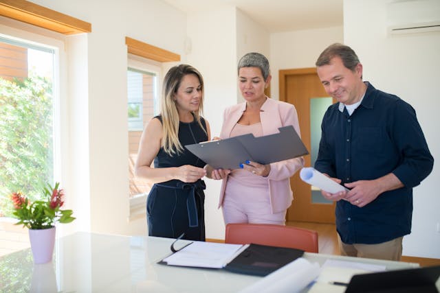 a%20property%20manager%20speaking%20with%20two%20people%20in%20a%20home a%20manager%20speaking%20with%20two%20people%20in%20a%20home